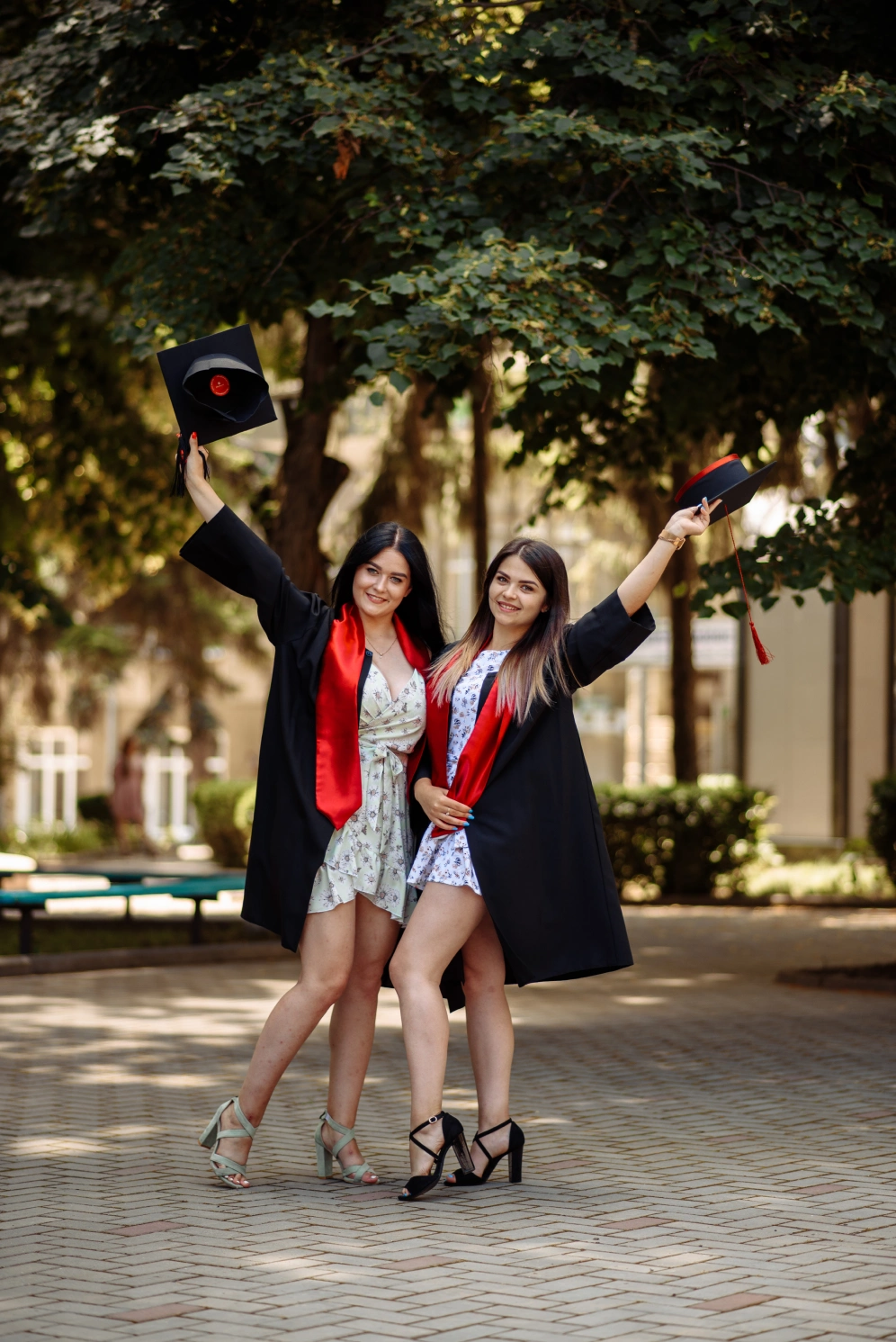 two-women-pose-picture-with-hat-their-head